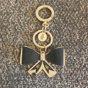 Harrods Elegant Black and Gold Bow Keychain